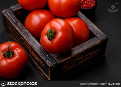 Delicious fresh juicy tomatoes on a dark concrete background. Sauce Ingredients