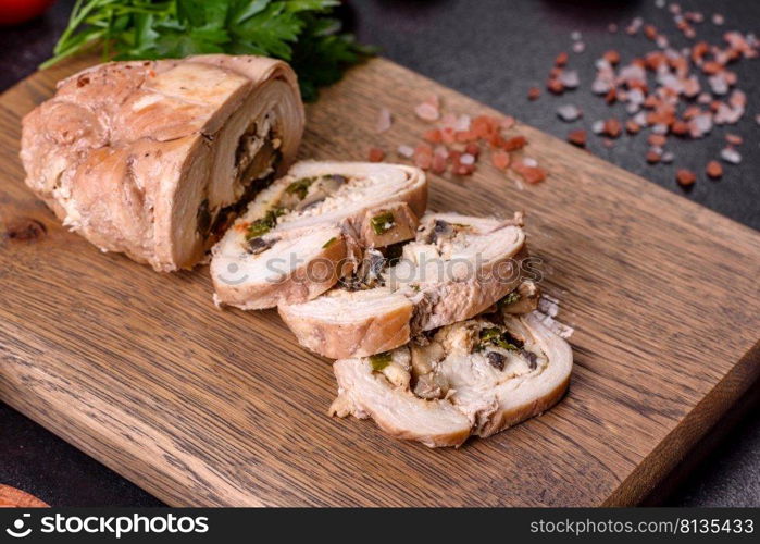 Delicious fresh meat roll made from chicken fillet, mushrooms, spices and herbs. Delicious healthy dish cooked at home. Delicious fresh meat roll made from chicken fillet, mushrooms, spices and herbs