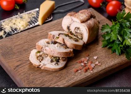 Delicious fresh meat roll made from chicken fillet, mushrooms, spices and herbs. Delicious healthy dish cooked at home. Delicious fresh meat roll made from chicken fillet, mushrooms, spices and herbs