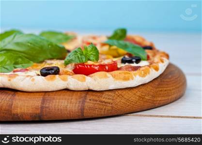 Delicious fresh pizza served on wooden table