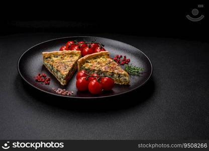 Delicious fresh quiche with broccoli, cheese, spices and herbs cut into pieces on a dark concrete background
