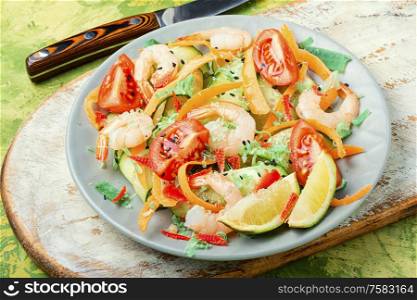 Delicious fresh salad of prawns and vegetable.Salad plate with shrimp. Salad with shrimp and vegetables