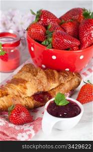 Delicious fresh strawberries and croissant