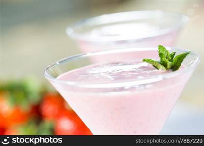 Delicious fresh strawberry milkshake served in cup
