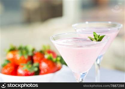 Delicious fresh strawberry milkshake served in cup