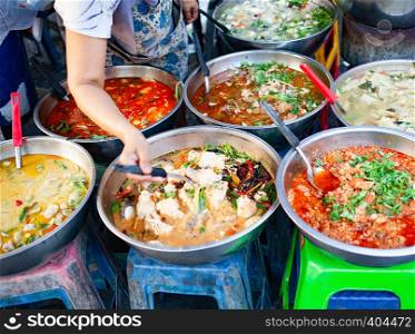 delicious fresh street food in Thailand - top view - Thai Curry, Tamarind, Tom Yam, Shrimp, Pork, Pad Thai