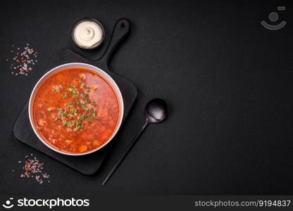 Delicious fresh Ukrainian borscht with beets, carrots and cabbage. Vegetarian dish