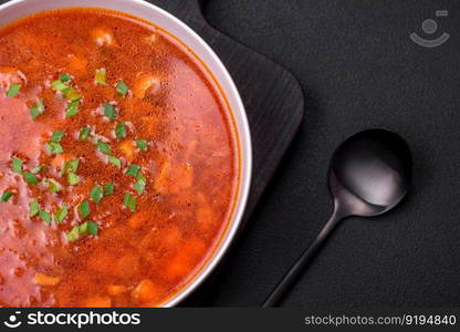 Delicious fresh Ukrainian borscht with beets, carrots and cabbage. Vegetarian dish