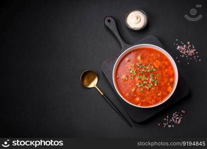 Delicious fresh Ukrainian borscht with beets, carrots and cabbage. Vegetarian dish