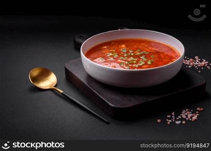 Delicious fresh Ukrainian borscht with beets, carrots and cabbage. Vegetarian dish