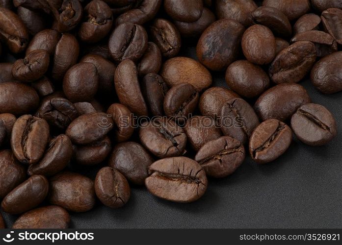 Delicious freshly roasted coffee beans. Macro. Sharpness across the frame