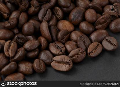 Delicious freshly roasted coffee beans. Macro. Sharpness across the frame