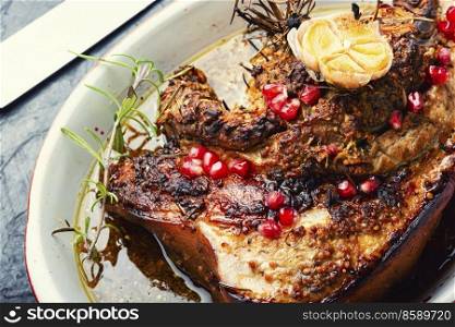 Delicious fried pork belly with spices, herbs and pomegranate.. Grilled pork belly with herbs.