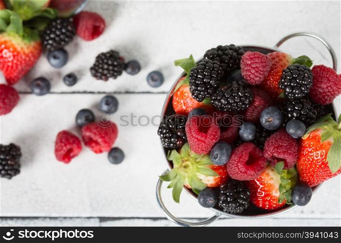 Delicious fruit and wild strawberries collected in a basket