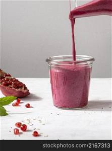 delicious fruit smoothie with pomegranate