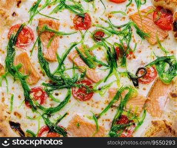 Delicious gourmet pizza with salmon and seaweed
