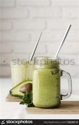 delicious green smoothie with avocado. Resolution and high quality beautiful photo. delicious green smoothie with avocado. High quality beautiful photo concept