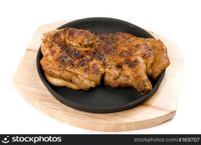 delicious grilled chicken on a pan isolated over white background