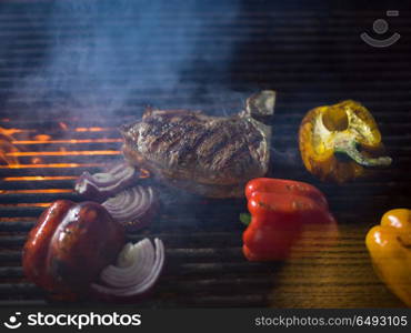 delicious grilled meat steak with vegetables on a barbecue. steak with vegetables on a barbecue