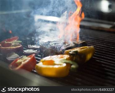 delicious grilled meat steak with vegetables on a barbecue. steak with vegetables on a barbecue
