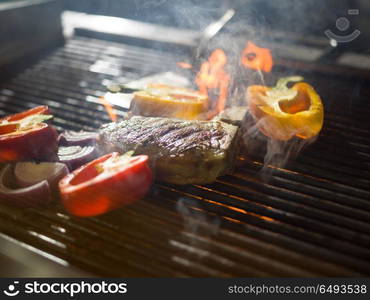 delicious grilled meat steak with vegetables on a barbecue. steak with vegetables on a barbecue