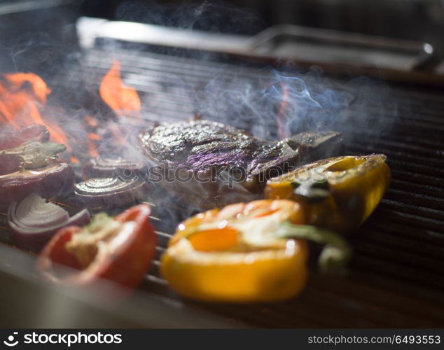 delicious grilled meat steak with vegetables on a barbecue. steak with vegetables on a barbecue