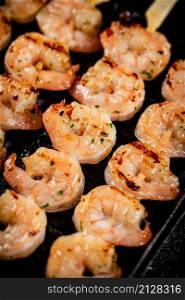 Delicious grilled shrimp. Macro background. High quality photo. Delicious grilled shrimp. Macro background.