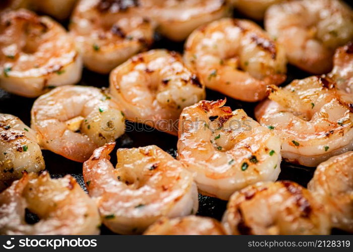 Delicious grilled shrimp. Macro background. High quality photo. Delicious grilled shrimp. Macro background.