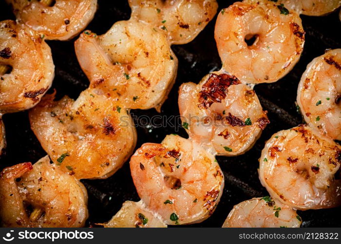 Delicious grilled shrimp. Macro background. High quality photo. Delicious grilled shrimp. Macro background.