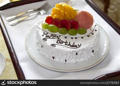 Delicious happy birthday cake closeup