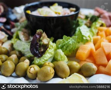 Delicious healthy salad on plate, with Olives