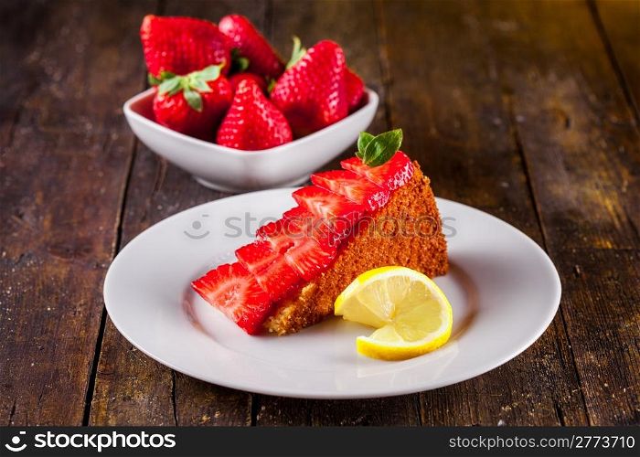 Delicious homemade cake with strawberries and lemon
