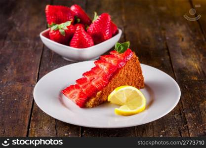 Delicious homemade cake with strawberries and lemon