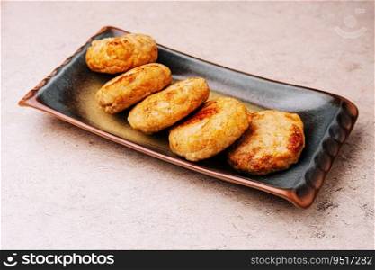 Delicious homemade cutlets in ceramic plate