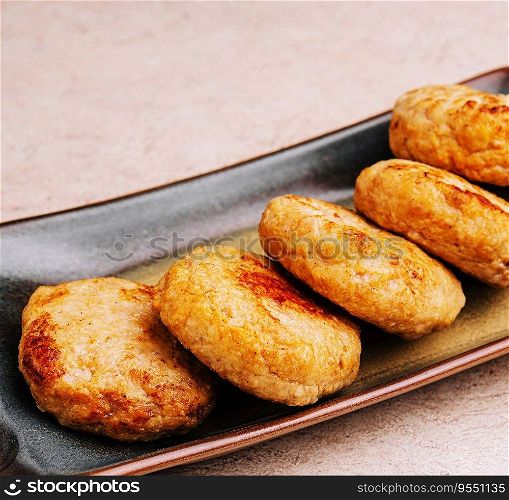 Delicious homemade cutlets in ceramic plate