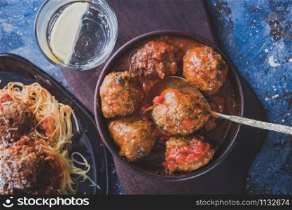 Delicious homemade meat balls in tomato sauce. Toned image.