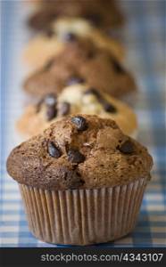 delicious homemade muffins over blue and white kitchen table selective focus