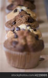 delicious homemade muffins over wooden board selective focus
