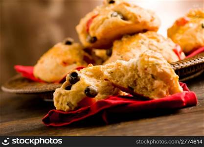 delicious homemade pizza rolls stuffed with cherry tomatoes and olives