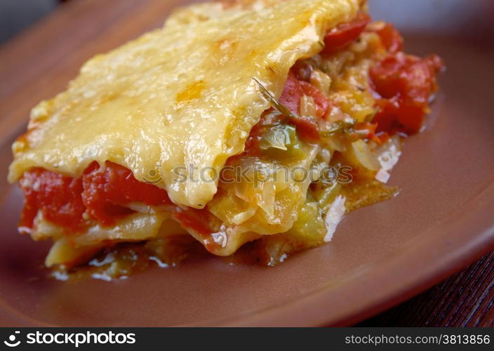 delicious homemade vegetable lasagna with tomato, paprika, onion and zucchini