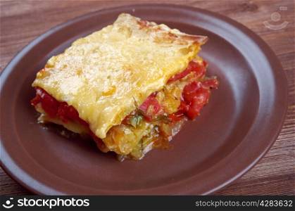 delicious homemade vegetable lasagna with tomato, paprika, onion and zucchini