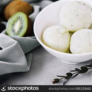 Delicious ice cream with mint and kiwi in bowl