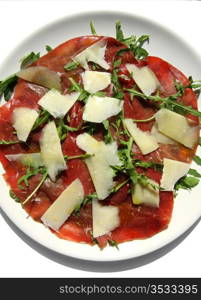 delicious italian Carpaccio plate with beef slices and Parmesan cheese. Italian Carpaccio plate