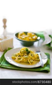 delicious italian fresh tortellini with butter and sage on green wooden table