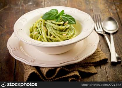 Delicious italian pasta with ligurian pesto and pine nuts