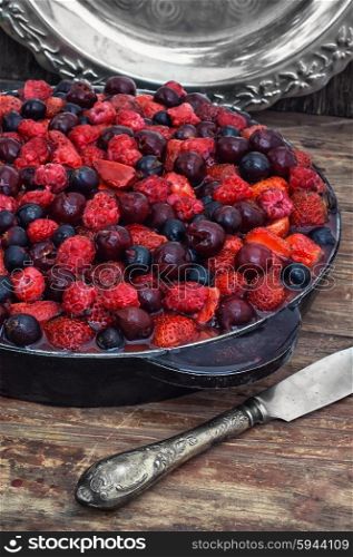 Delicious jelly cake with fresh berries strawberries,raspberries and currants