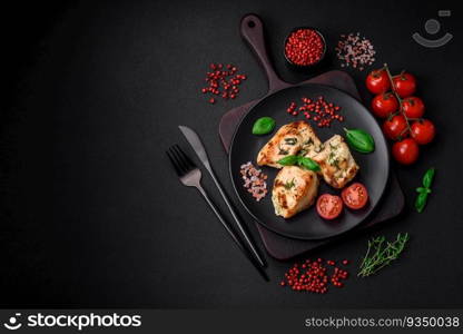 Delicious juicy chicken, turkey skewers with salt, spices and herbs on a dark concrete background