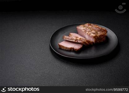 Delicious juicy pork or beef steak cooked on the grill with salt and spices on a textured concrete background