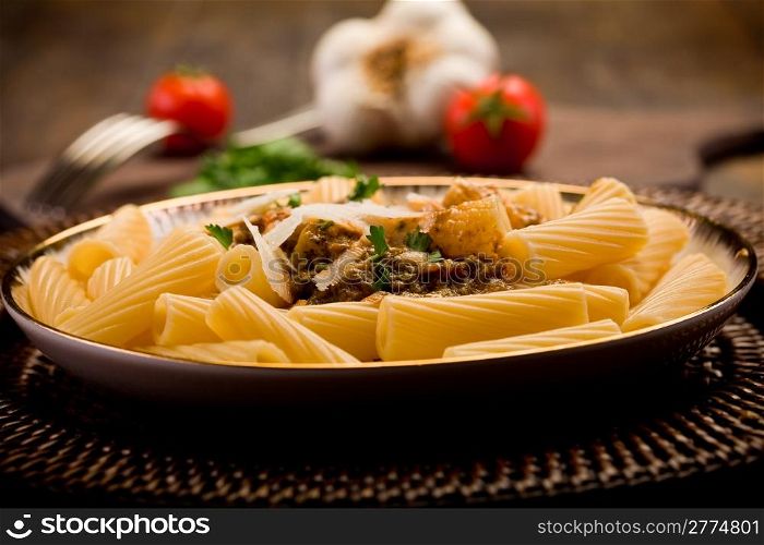 delicious macaroni pasta with sicilian pesto on wooden table