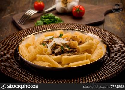 delicious macaroni pasta with sicilian pesto on wooden table